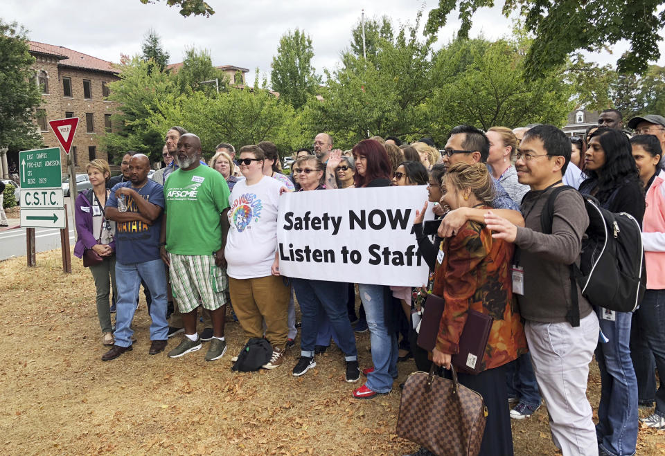 Workers rally at Western State Hospital in Lakewood, Wash., on Thursday, Aug. 30, 2018. Assaults on staff at the psychiatric hospital have led to staff demanding changes to the way officials assign dangerous patients to wards. (AP Photo/Martha Bellisle)