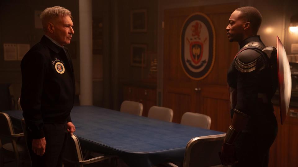 Thaddeus Ross and Sam Wilson stare at each other in a room in the White House in Captain America: Brave New World