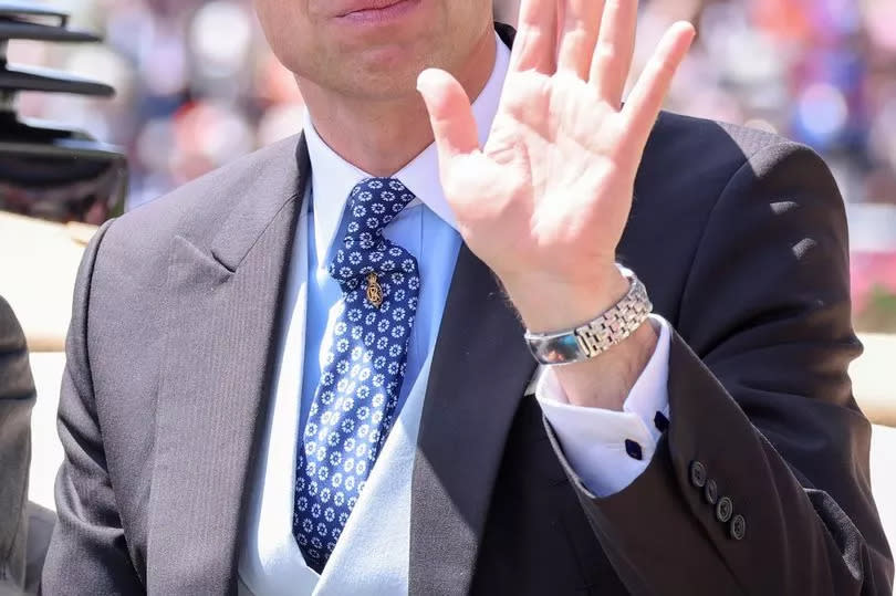 Prince William, Prince of Wales smiles and waves as he attends day two of Royal Ascot