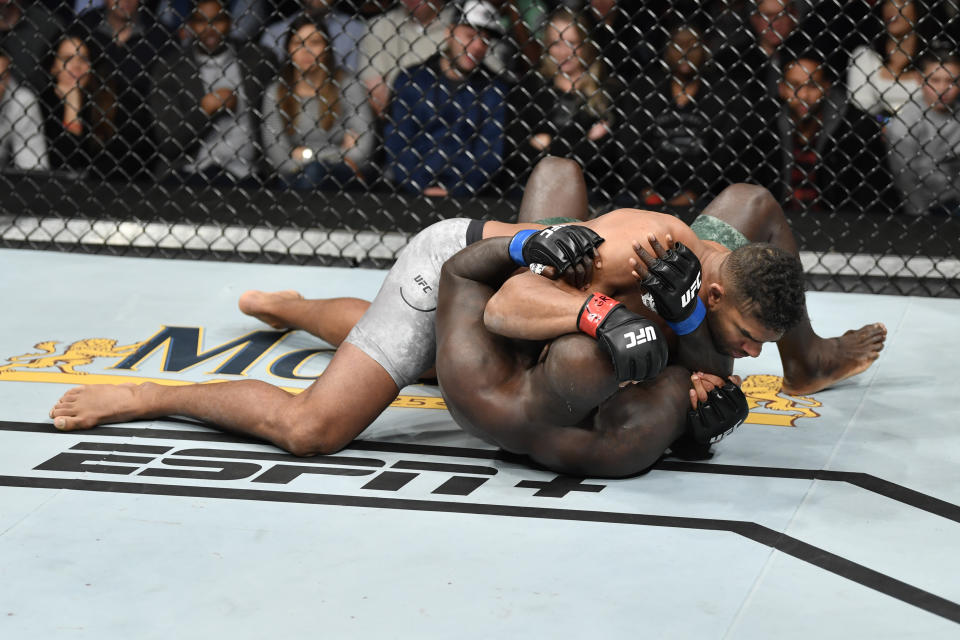 WASHINGTON, DC - DECEMBER 07: Alistair Overeem of Netherlands (top) wrestles Jairzinho Rozenstruik of Suriname in their heavyweight bout during the UFC Fight Night event at Capital One Arena on December 07, 2019 in Washington, DC. (Photo by Jeff Bottari/Zuffa LLC via Getty Images)