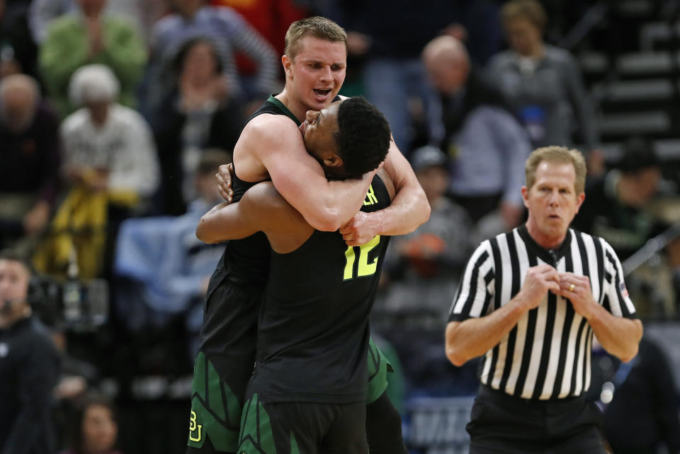 Baylor guard Makai Mason, left, and guard Jared Butler (12) celebrate the team's win against Syracuse in a first-round game in the NCAA men’s college basketball tournament Thursday, March 21, 2019, in Salt Lake City. (AP Photo/Jeff Swinger)