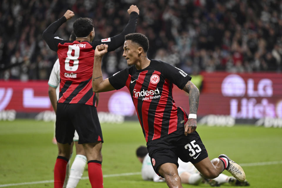 Frankfurt's Tuta celebrates after scoring their side's first goal of the game during the Bundesliga soccer match between Eintracht Frankfurt and Werder Bremen at the Deutsche Bank Park stadium in Frankfurt, Germany, Friday April 5, 2024. (Arne Dedert/dpa via AP)