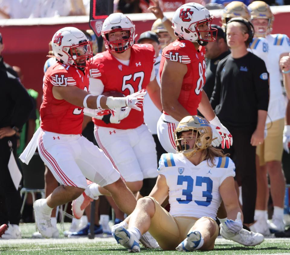 The Ute defense tackle UCLA Bruins running back Carson Steele (33) in Salt Lake City on Saturday, Sept. 23, 2023. | Jeffrey D. Allred, Deseret News