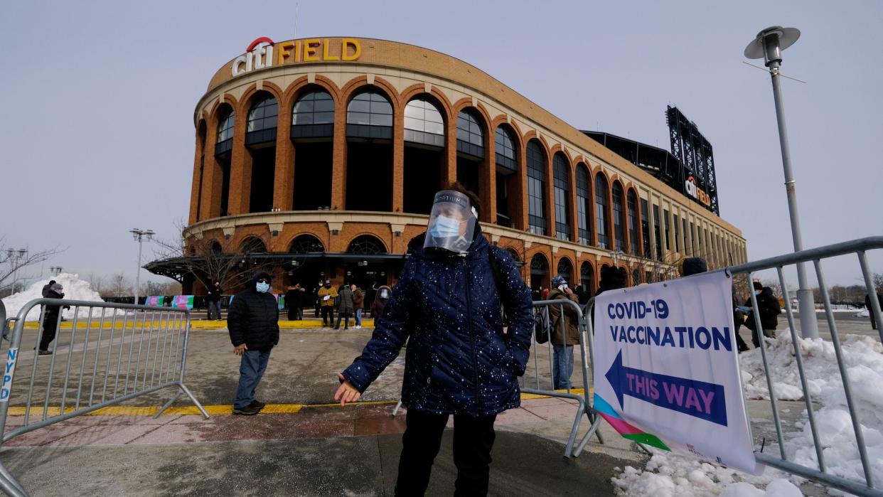 Nelly Torres is pictured outside Citi Field after vaccinations began at the Queens stadium. 