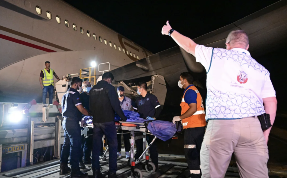 An injured Palestinian evacuated from the Gaza Strip is transported to an Emirati aircraft at Egypt's Arish airport, to receive treatment in the United Arab Emirates, on July 5. Giuseppe Cacace/AFP/Getty Images