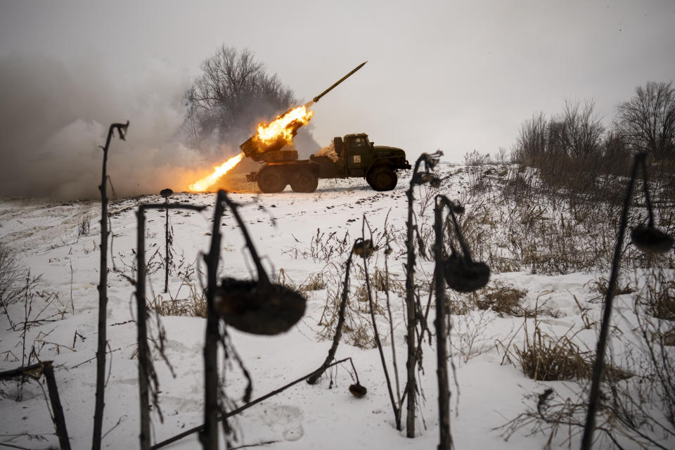 FILE - Ukrainian servicemen of the Prince Roman the Great 14th Separate Mechanized Brigade fire a Soviet era Grad multiple rocket launcher at Russian positions in the Kharkiv area, Ukraine, Saturday, Feb. 25, 2023. Grueling artillery battles have stepped up in recent weeks in the vicinity of Kupiansk, a strategic town on the eastern edge of Kharkiv province by the banks of the Oskil River as Russian attacks intensifying in a push to capture the entire industrial heartland known as the Donbas, which includes the Donetsk and the Luhansk provinces. (AP Photo/Vadim Ghirda, File)