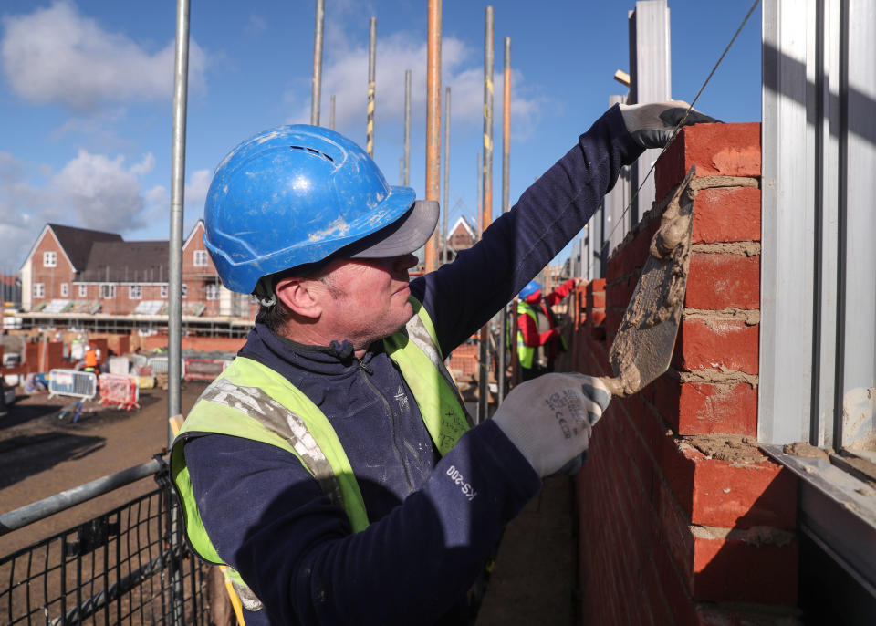 A bricklayer working for Taylor Wimpey builds a wall on an estate in Aylesbury, Britain February 7, 2017.  REUTERS/Eddie Keogh