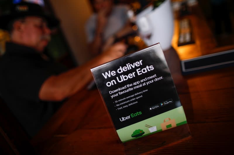 A flyer advertising Uber Eats delivery service is pictured at a restaurant in Cape Town