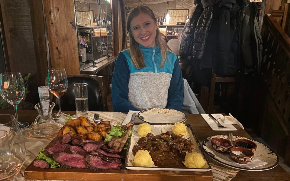 Marianna tucking into reindeer stew, beef fillet and sautéed potatoes at Molerite