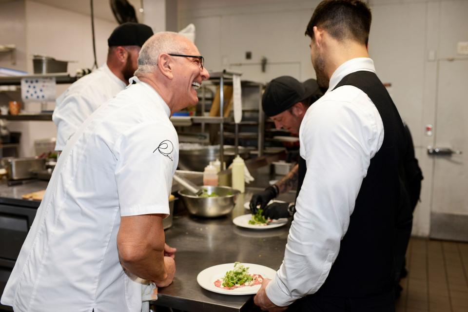 Celebrity chef Robert Irvine shares a laugh during the 2022 Palm Beach Food & Wine Festival.