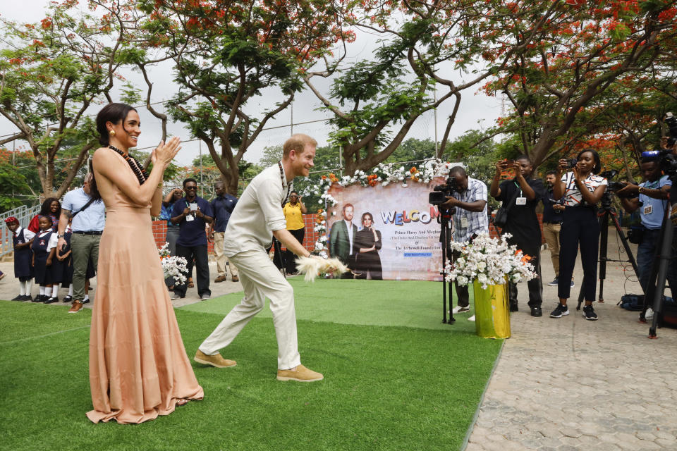 Prince Harry, Duke of Sussex and Meghan, Duchess of Sussex visit Lightway Academy wearing formal dress shoes