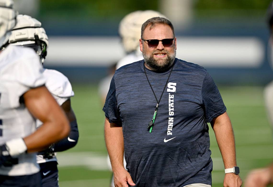 Penn State offensive coordinator Andy Kotelnicki yells to the players as they move between drills at practice on Wednesday, July 31.