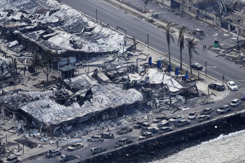 Wildfire wreckage is shown Thursday, Aug. 10, 2023, in Lahaina, Hawaii. The search of the wildfire wreckage on the Hawaiian island of Maui on Thursday revealed a wasteland of burned out homes and obliterated communities as firefighters battled the stubborn blaze making it the deadliest in the U.S. in recent years. (AP Photo/Rick Bowmer)