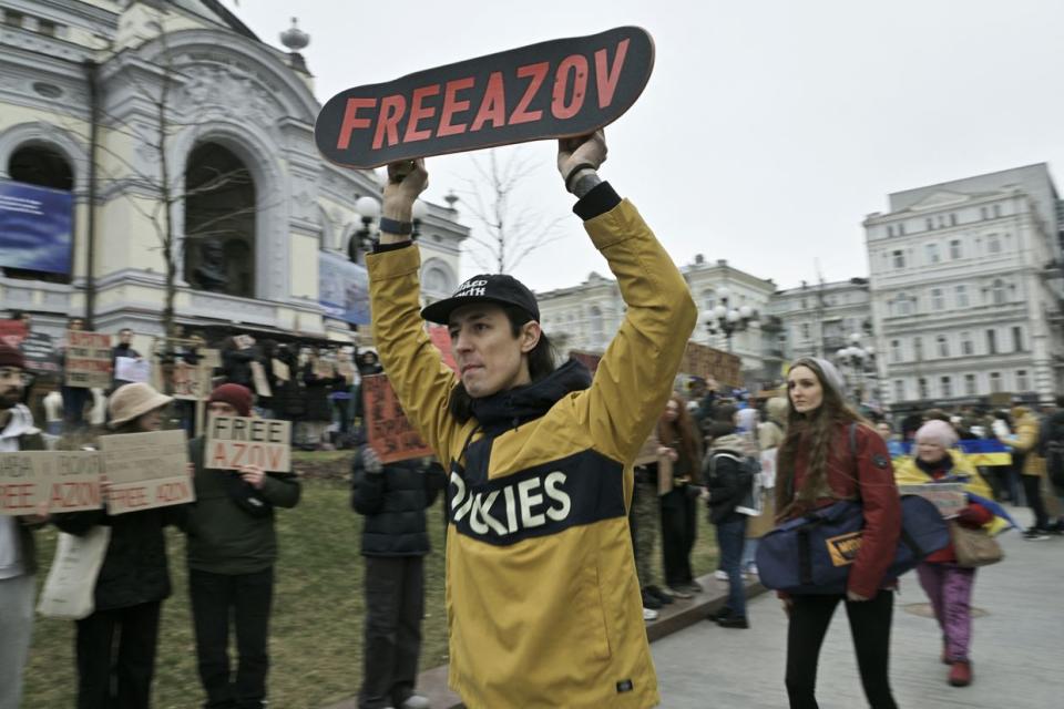 Relatives and friends of Ukrainian prisoners of war from the Azov Brigade and sub-units hold placards during a rally in front of the Opera building in central Kyiv on March 17, 2024, calling for their exchange with Russian prisoners, amid the Russian invasion of Ukraine. (Genya Savilov/AFP via Getty Images)