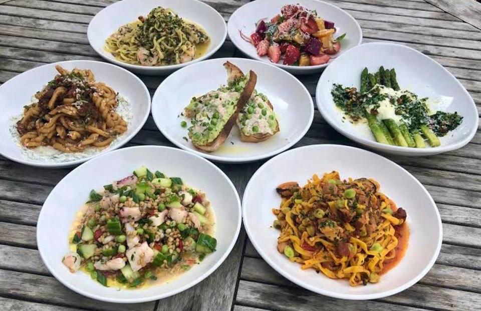 Clockwise from top left: linguine scampi, a strawberry-beet salad, asparagus Milanese, linguine with mussels and pancetta, an octopus-farro salad, pasta with braised lamb and (center) crostini with crab.