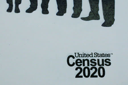 An informational pamphlet is displayed at an event for community activists and local government leaders to mark the one-year-out launch of the 2020 Census efforts in Boston, Massachusetts, U.S., April 1, 2019. REUTERS/Brian Snyder