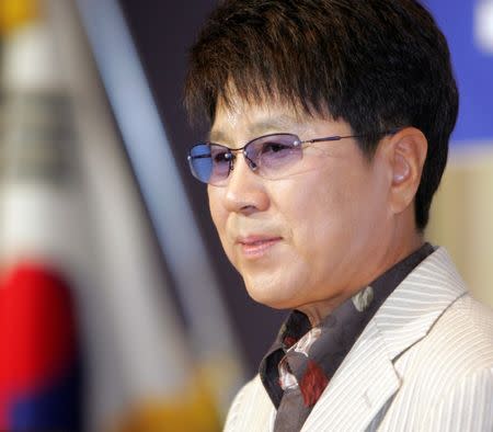 South Korea's pop singer Cho Yong-pil speaks at a news conference in Seoul, August 3, 2005. Cho said on Wednesday he would hold a solo concert in the North Korean capital of Pyongyang on August 23, 2005, which will be broadcasted live from Pyongyang to Seoul by the South Korean television network SBS. REUTERS/You Sung-Ho LJW/JK