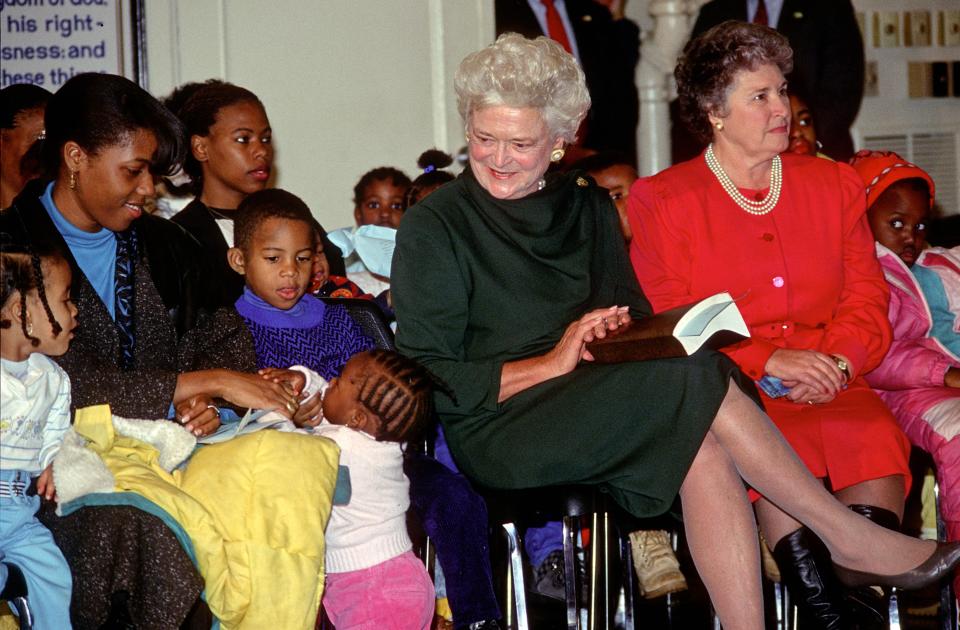 Barbara Bush at a Christmas party with children in 1989.