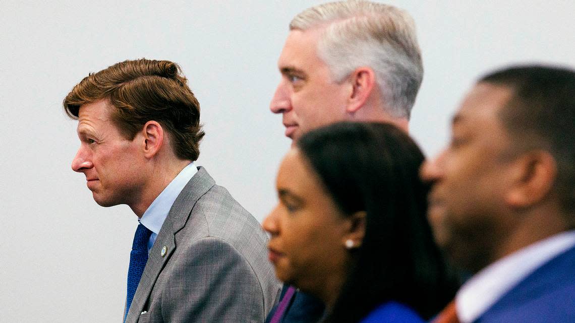 UNC-Chapel Hill Interim Chancellor Lee Roberts, left, listens during a meeting of the UNC System Board of Governors on Thursday, May 23, 2024, in Raleigh, N.C.