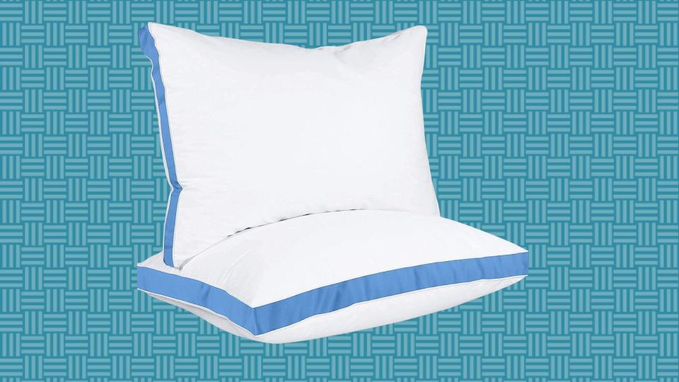 white bed pillows with blue trim