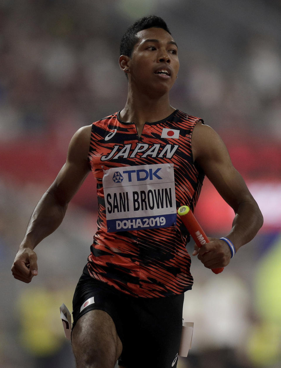 Japan's Abdul Hakim Sani Brown races in a men's 4x100 meter relay semifinal at the World Athletics Championships in Doha, Qatar, Friday, Oct. 4, 2019. (AP Photo/Petr David Josek)