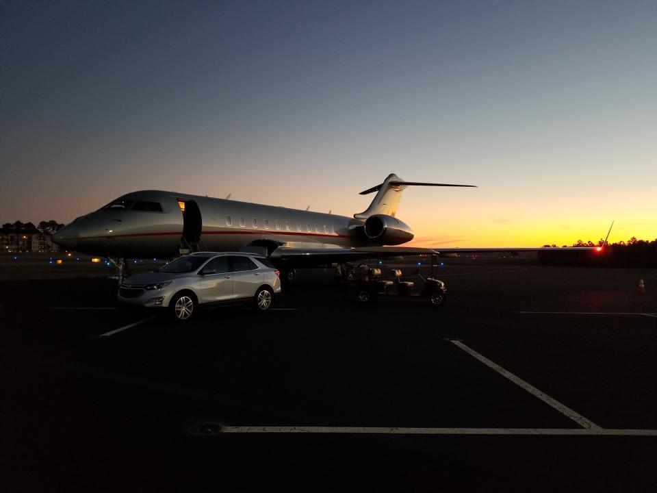 A vehicle meets the passengers of this jet soon after it lands at Cape Fear Jetport.