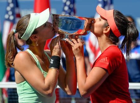 Sep 13, 2015; New York, NY, USA; Martina Hingis of Switzerland and Sania Mirza of India with the US Open Trophy after beating Casey Dellacqua of Australia and Yaroslava Shvedova of Kazakhstan in the Women's Doubles final on day fourteen of the 2015 U.S. Open tennis tournament at USTA Billie Jean King National Tennis Center. Robert Deutsch-USA TODAY Sports