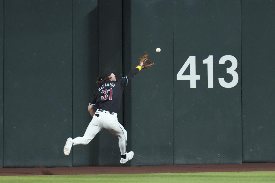 Arizona Diamondbacks center fielder Jake McCarthy make a running catch on a line drive hit by Los Angeles Dodgers' Freddie Freeman during the first inning of a baseball game Sunday, Sept. 1, 2024, in Phoenix. (AP Photo/Ross D. Franklin)