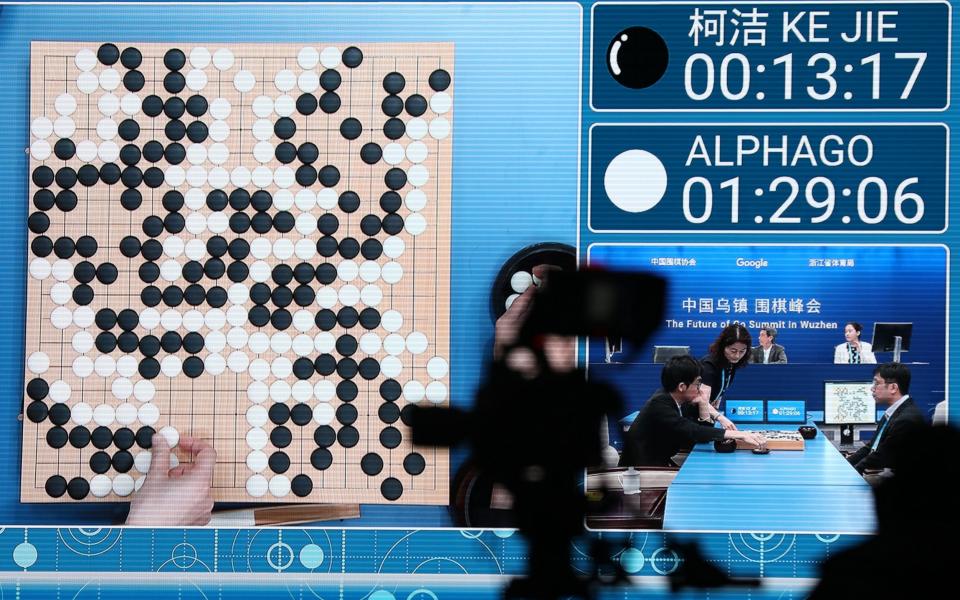 A screen shows referees judging after the match featuring Ke Jie against AlphaGo  - Credit: EPA