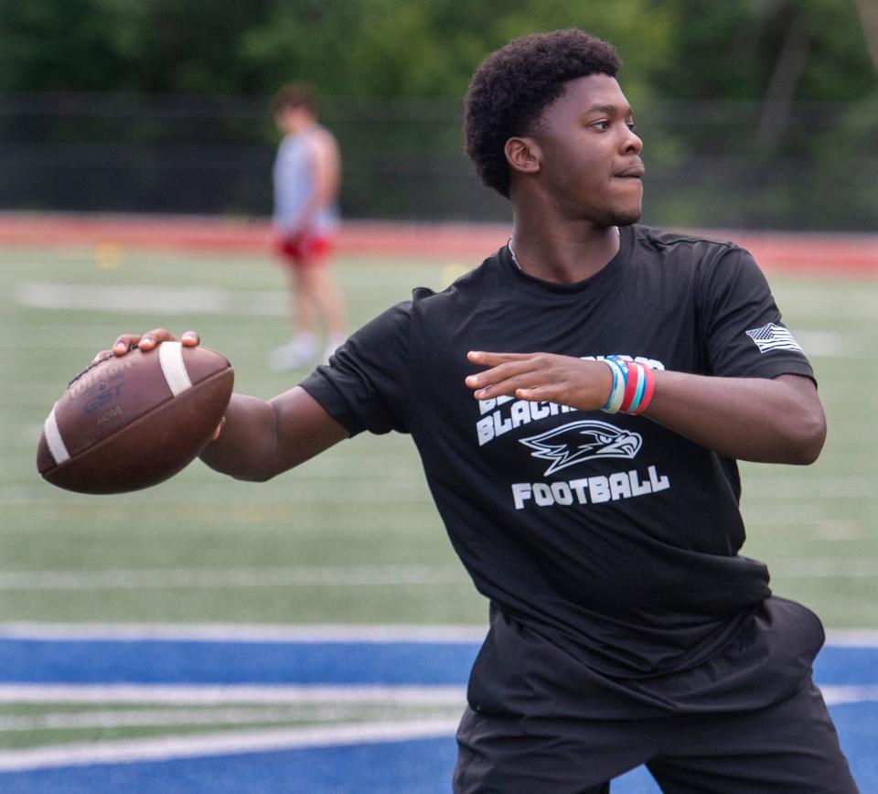 Bellingham High School quarterback Dasha Domercant warms up before Tuesday's evening's  seven on seven Friendship League at Ashland High School, July 18, 2023.  Twelve area schools are taking part in the annual summer passing league.