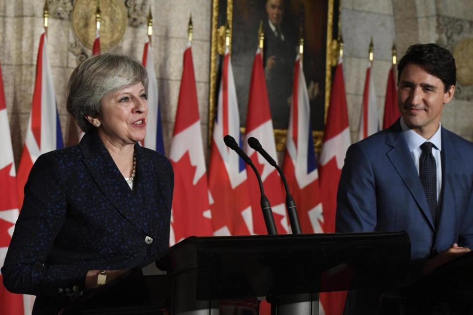 Theresa May and Justin Trudeau take part in a joint news conference (AP)