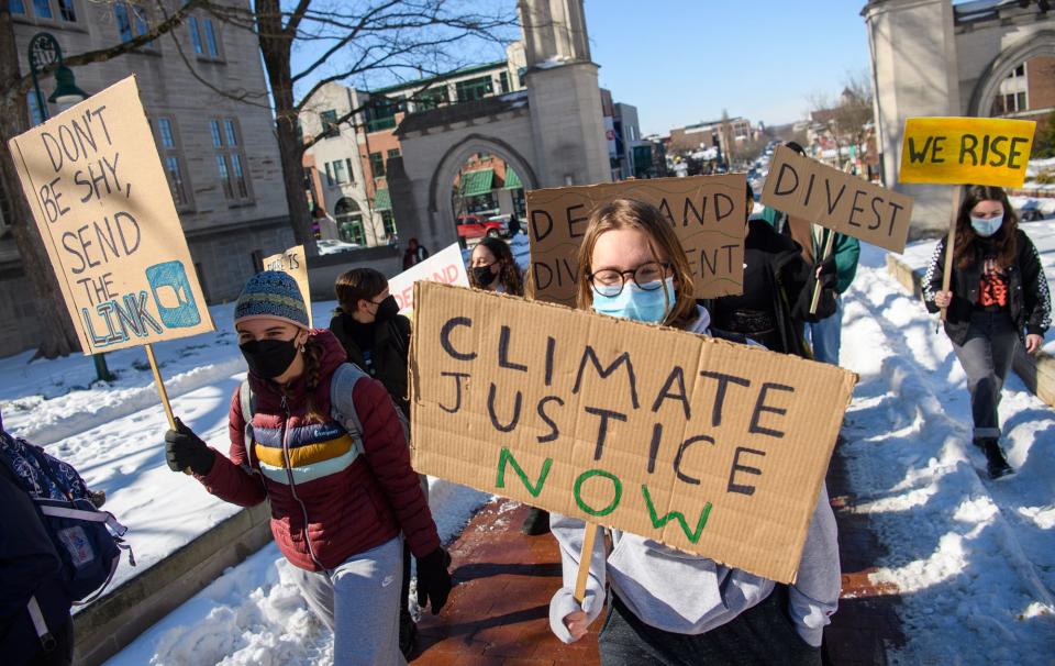 Indiana University students protest the school's investment portfolio and its effects on climate change at the Sample Gates on Tuesday, Feb. 8, 2022.