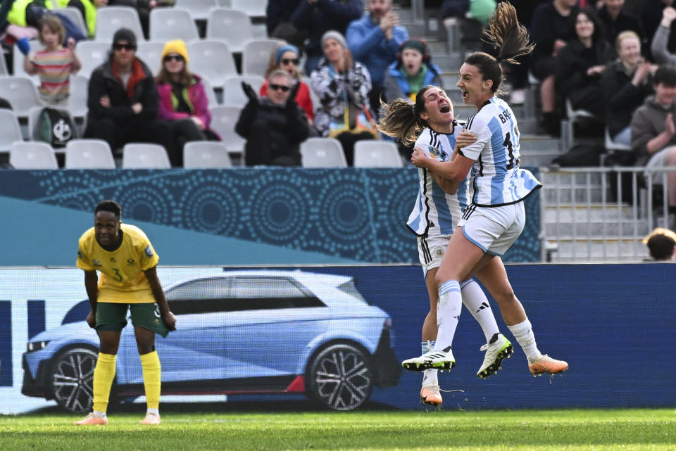 Argentina's Sophia Braun, right, celebrates with a teammate after scoring her team's first goal during the Women's World Cup Group G soccer match between Argentina and South Africa in Dunedin, New Zealand, Friday, July 28, 2023. (AP Photo/Andrew Cornaga)