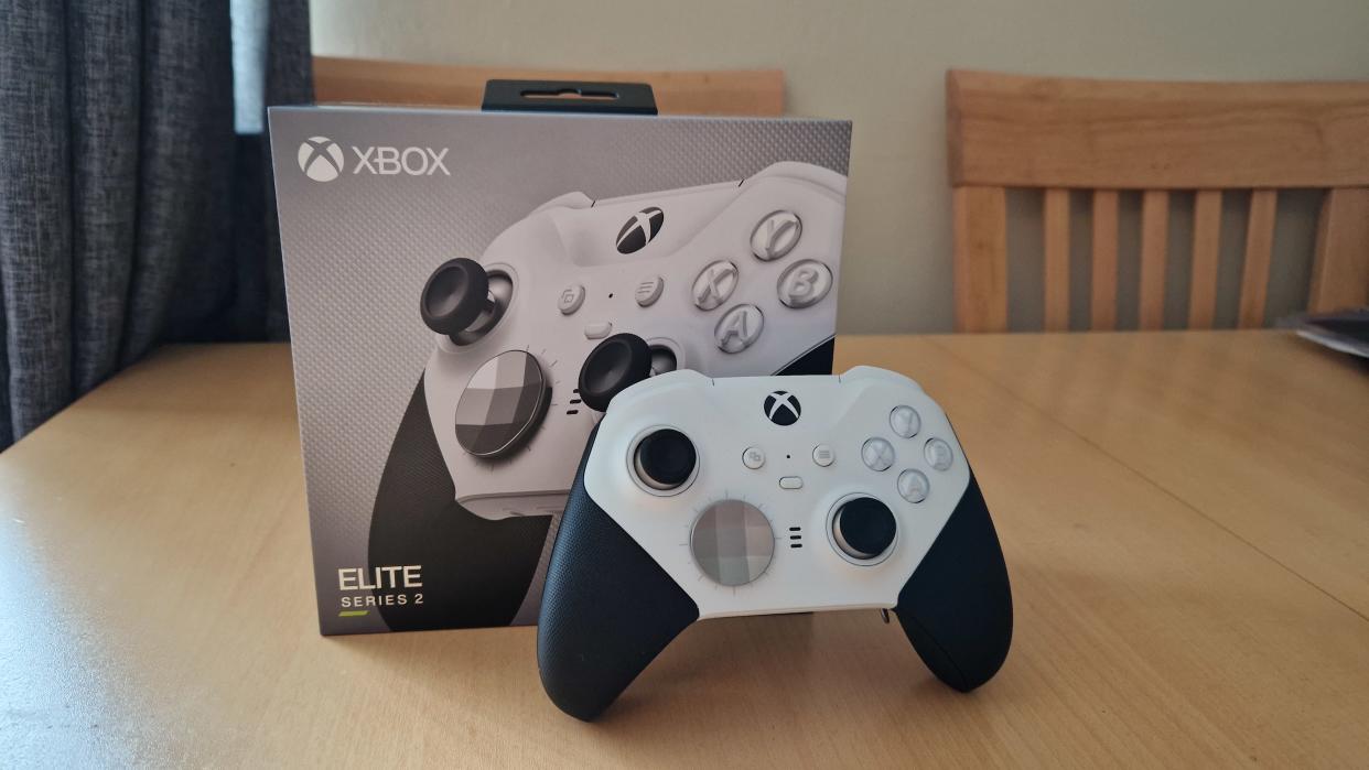  Xbox Elite Series 2 Core review hero image showing the controller standing up in front of its box 