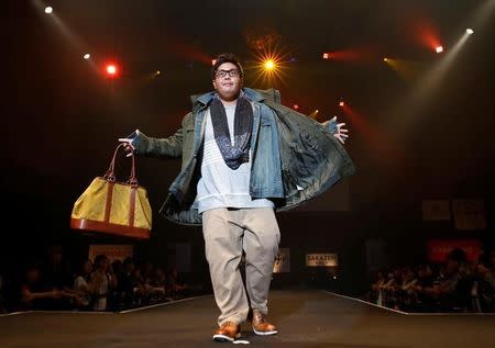 A model poses on the runway during Tokyo Pocchari collection, Japan's first fashion show for the plump men in Tokyo. REUTERS/Kim Kyung-Hoon