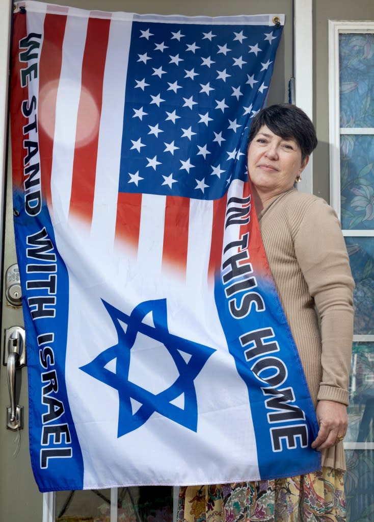 Shali-Ogli, at home above, hung an Israeli flag on her office door in school. Aristide Economopoulos