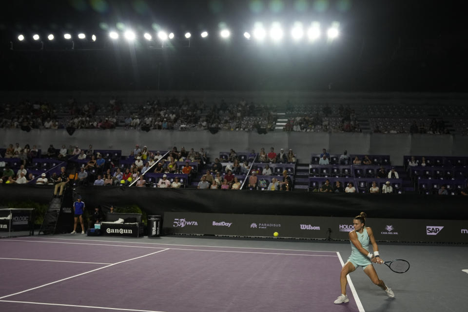 Maria Sakkari of Greece returns a shot to Jessica Pegula of the United States, during a women's singles match at the WTA Finals tennis championships, in Cancun, Mexico, Thursday, Nov. 2, 2023. (AP Photo/Fernando Llano)