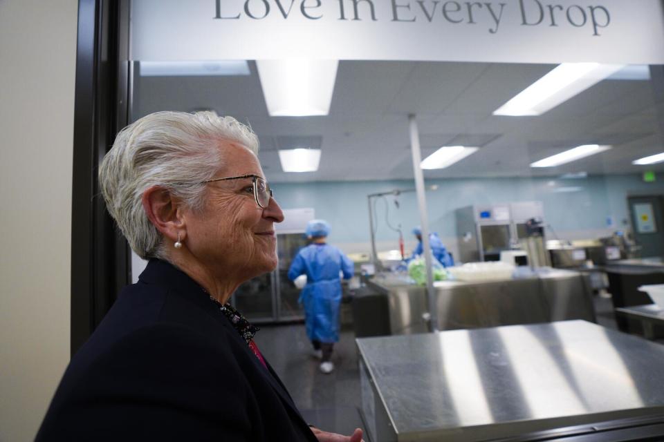 Dr. Lisa Stillwagen, a co-director of the Human Milk Institute, walks through the milk bank.