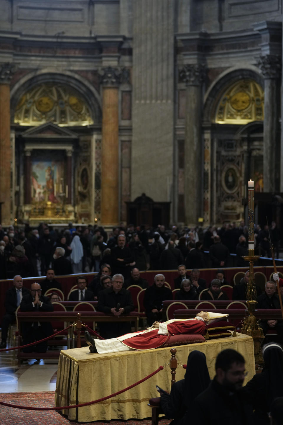 The body of late Pope Emeritus Benedict XVI is lied out in state inside St. Peter's Basilica at The Vatican, Wednesday, Jan. 4, 2023. Pope Benedict, the German theologian who will be remembered as the first pope in 600 years to resign, has died, the Vatican announced Saturday, Dec. 31, 2022. He was 95.(AP Photo/Ben Curtis)