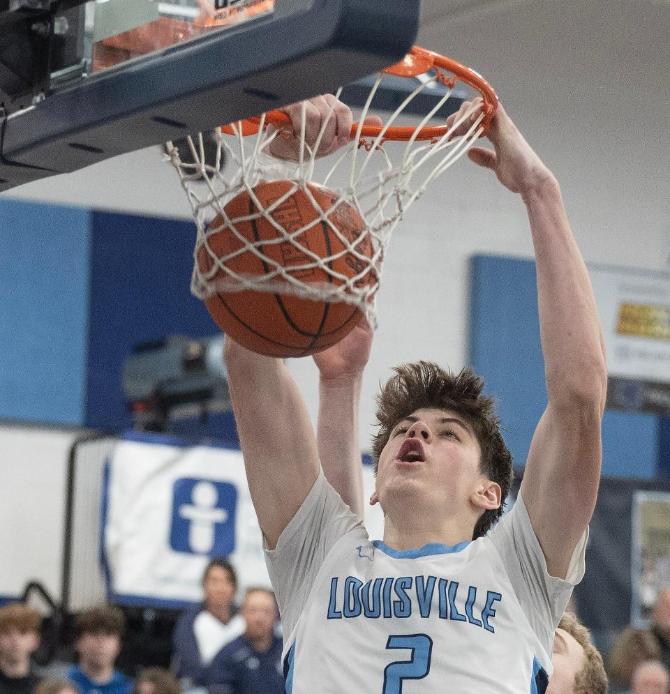 Louisville's Brayden Gross dunks in the fourth quarter against Lake at Louisville Tuesday January, 23, 2024.