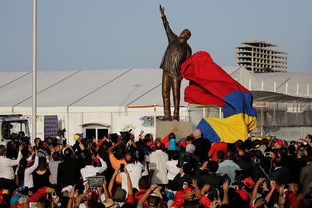 A statue of Venezuela's late President Hugo Chavez is unveiled during an event at the entrance of the Venetur Hotel Convention Center, venue of the 17th Non-Aligned Summit in Porlamar, Venezuela September 16, 2016. REUTERS/Marco Bello