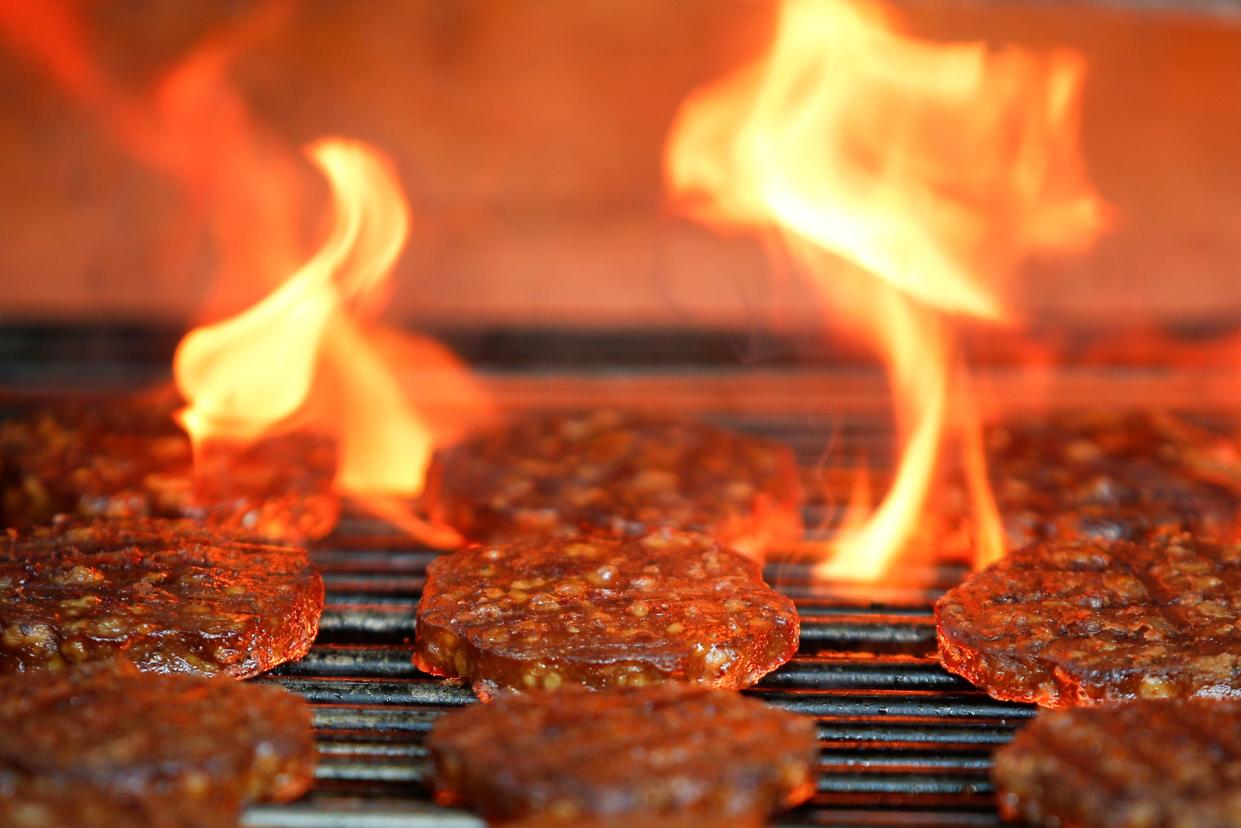 Veggie burgers are cooked over a flame on a grill in Greenwich, Connecticut, U.S., on June 26, 2017.