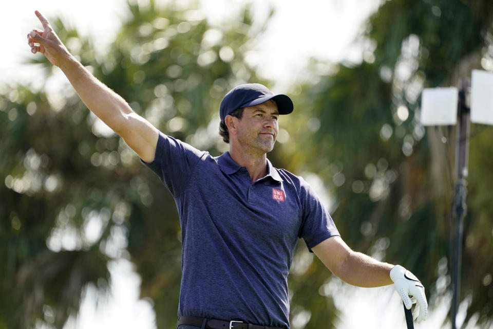 Adam Scott of Australia gestures after he hits from the fourth tee during the first round of the Honda Classic golf tournament, Thursday, March 18, 2021, in Palm Beach Gardens, Fla. (AP Photo/Marta Lavandier)