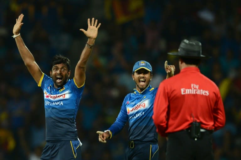 Dilruwan Perera (left) took three Australian wickets and conceded only 51 runs