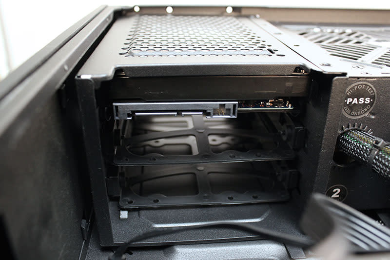 The 2TB Toshiba hard drive is located above the power supply unit.