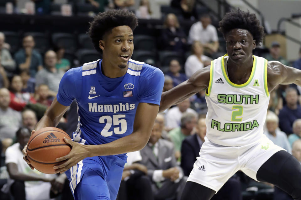 Memphis guard Jayden Hardaway (25) drives around South Florida guard Ezacuras Dawson III (2) during the first half of an NCAA college basketball game Sunday, Jan. 12, 2020, in Tampa, Fla. (AP Photo/Chris O'Meara)