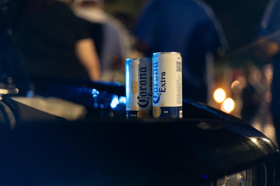 Two coronas sit on top of a 2019 Dodge Hellcat on Oct. 14, 2023, at the How Bazar A La Carte night market in downtown Gainesville, Florida.