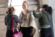 <p>Julia Garner smiles and prepares to film on the set of <em>Inventing Anna</em> in downtown N.Y.C. on Monday. </p>