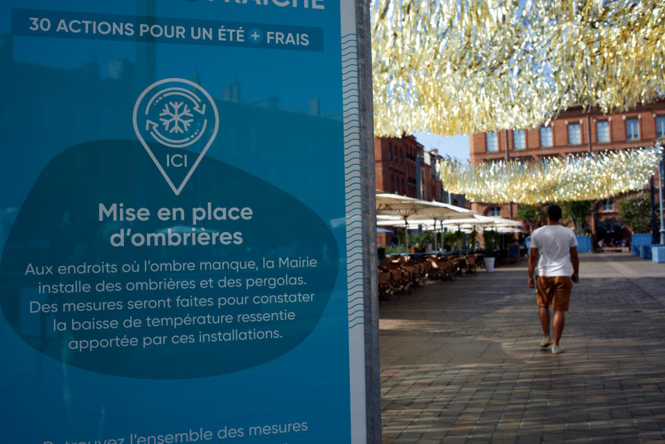 A man walks on the Capitole place (the main square in toulouse) under a shade device. France is suffocating under a new heatwave. Temperature records are and will be broken during this heatwave especially in the south. France is 8 to 15?C above normal temperatures for August. This heatwave is due to a heat dome and is qualified as 'extreme for the intensity, the duration and for being in late summer'. More than 15 departments such as Haute-Garonne (Toulouse) are placed on red alert on heat. Red alert on heat is announced when night temperatures are above 26?C and day temperatures are above 40?C.  Water restrictions are in place in all France, someplaces haven't drinking water and must be resupply with trucks. Toulouse. August 22th 2023. (Photo by Alain Pitton/NurPhoto via Getty Images)