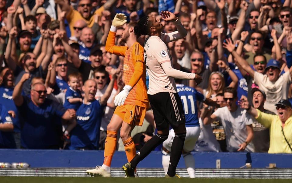 David De Gea and Chris Smalling show their frustration after Theo Walcott scores Everton's fourth - AFP